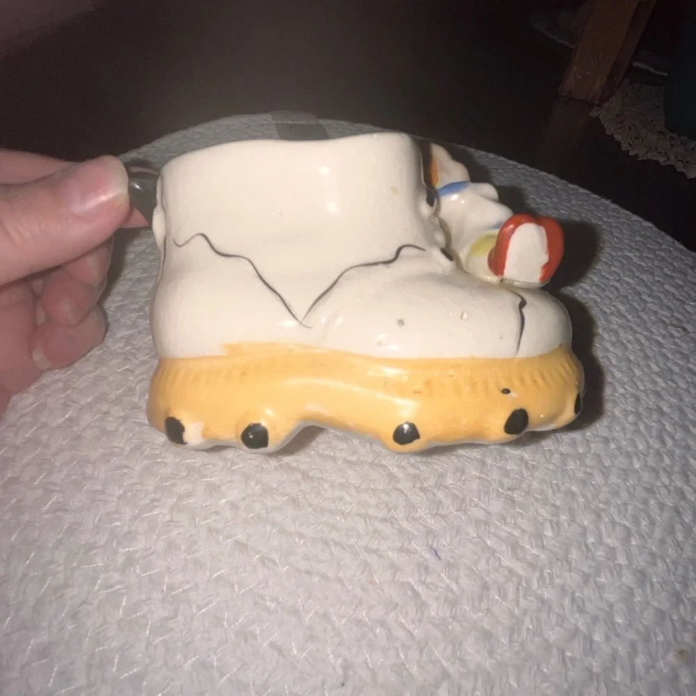 Vintage ceramic shoe with angel figurine planter